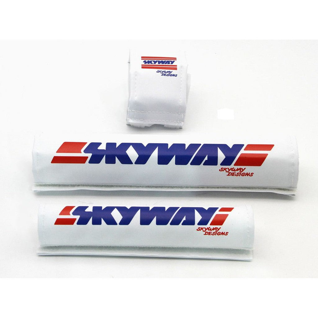 A pair of white and blue SKYWAY USA Made Retro Pad Sets with the Skyway logo on them.