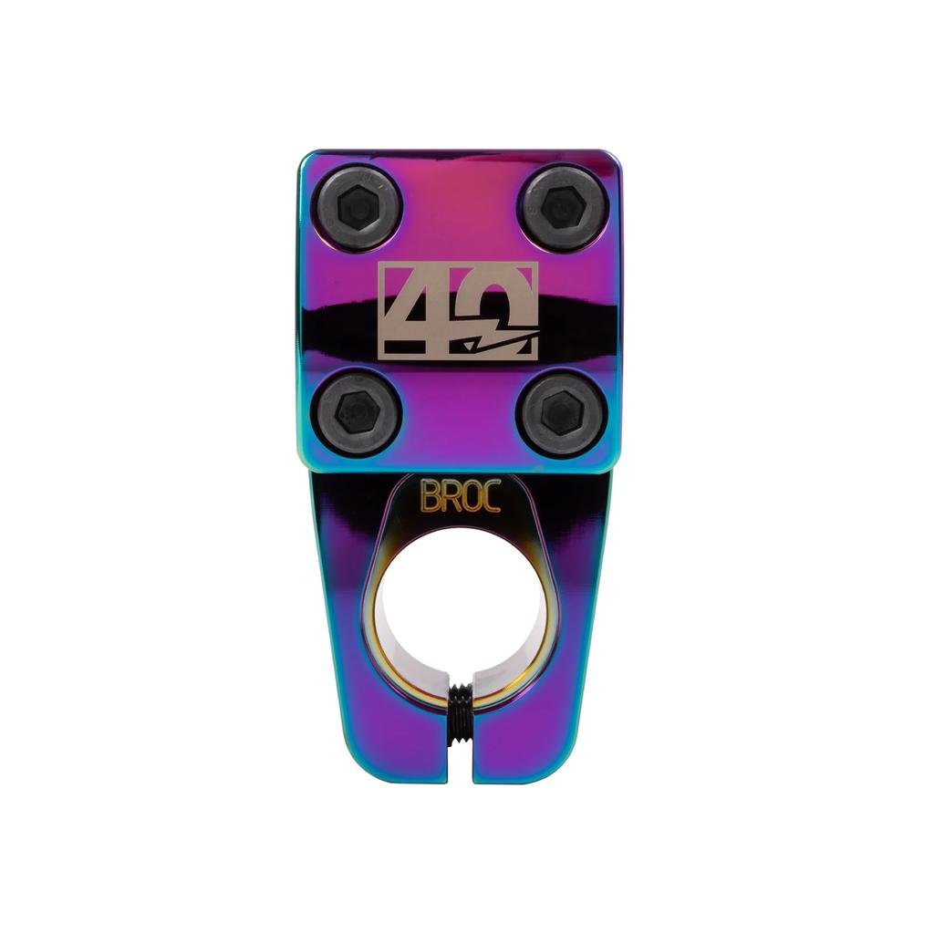 The limited-edition Odyssey Broc V2 40th Anniversary Top Load Stem showcases a colorful design with four bolts, engraved logos, and a circular clamp opening, embodying the Broc Raiford signature style.
