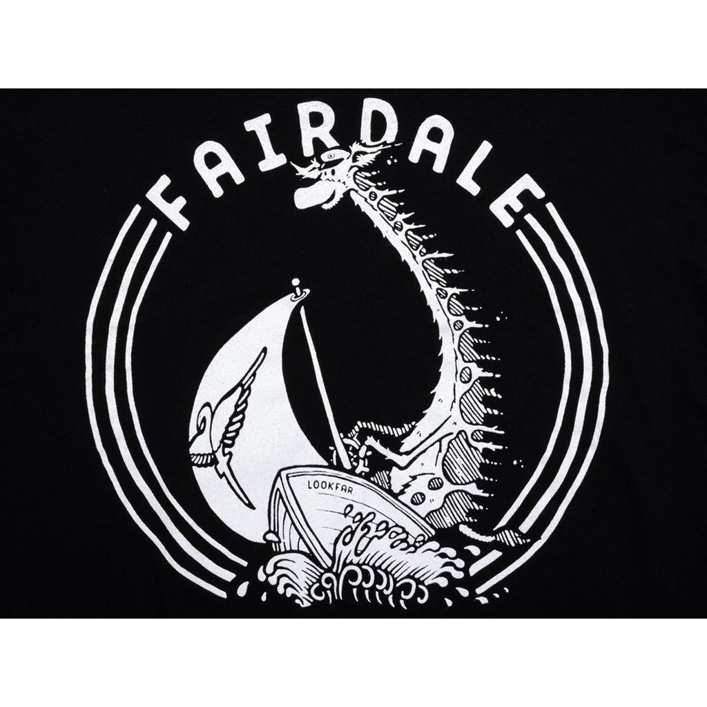 Black and white illustration of a sea monster behind a sailboat, with "FAIRDALE" above and "LOOKFAR" on the hull—featured on the Fairdale Sail On T-Shirt, perfect for sailboat tee enthusiasts.