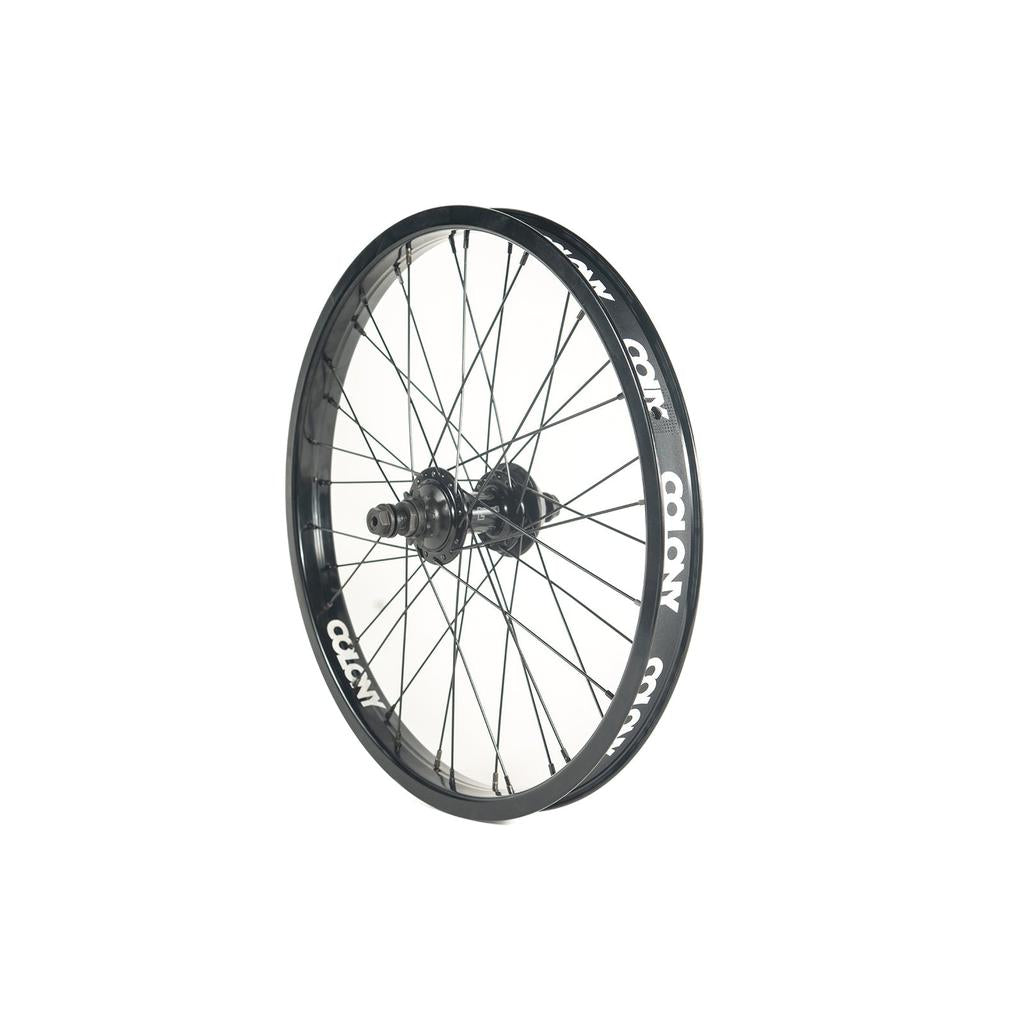 The Colony Contour X Wasp 20 Inch Rear Wheel is black with multiple spokes and white "COLONY" branding on the rim, featuring a Wasp cassette hub, displayed against a plain white background.
