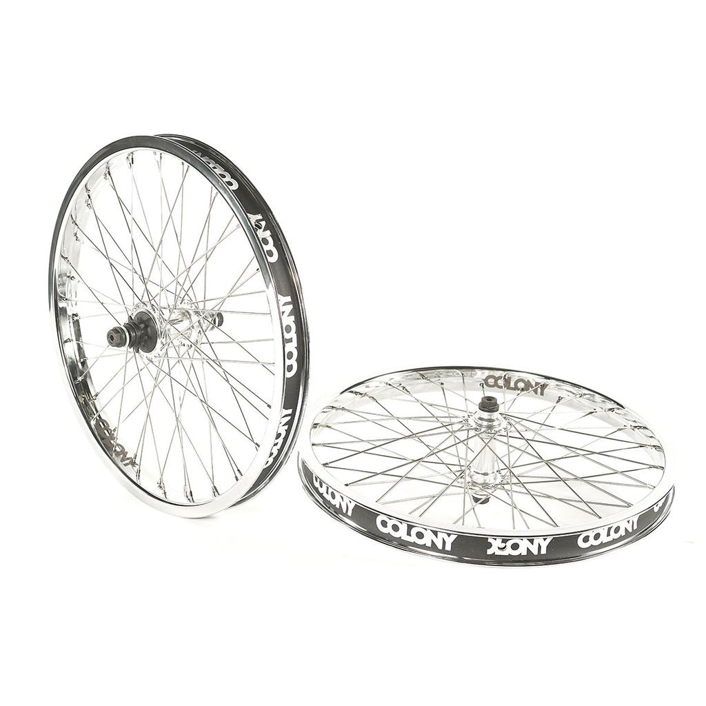 Two chrome Colony BMX Contour 48H Wheel Set bicycle wheels with black rims, "COLONY" branding, and strong Wasp hubs are shown—one upright, one flat—against a white background. Model: Chrome 9T.