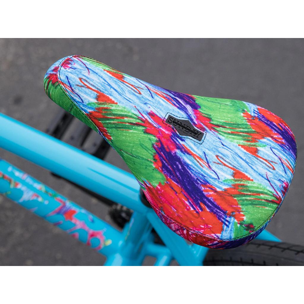 Close-up of a bicycle seat with a colorful, abstract pattern on the turquoise frame of the Sunday Forecaster 20 Inch Bike (2025) / Aaron Ross.
