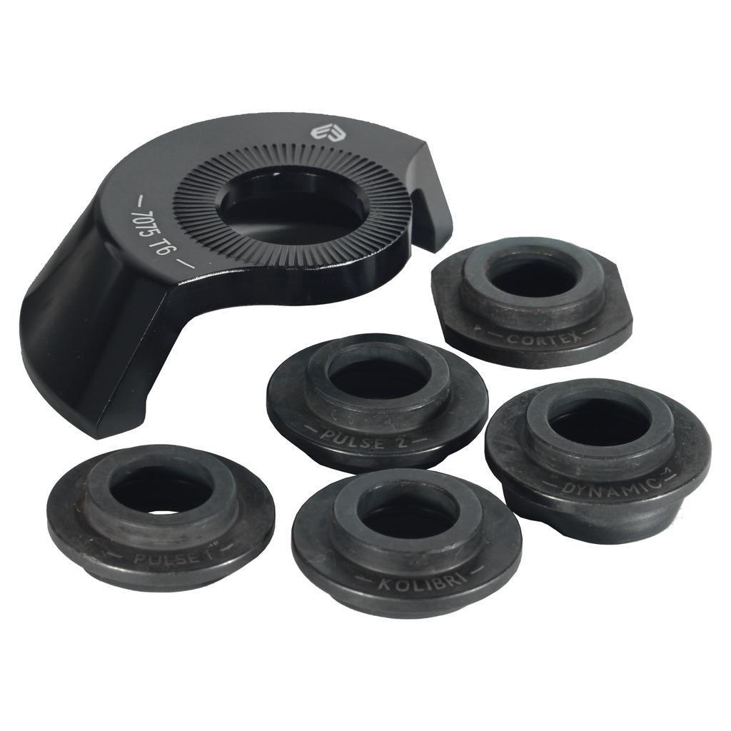 The Eclat Gong Rear Hub Driverguard (With Adaptors), a black metal guard with engraved labels for precise hub spacing, is arranged on a white background.