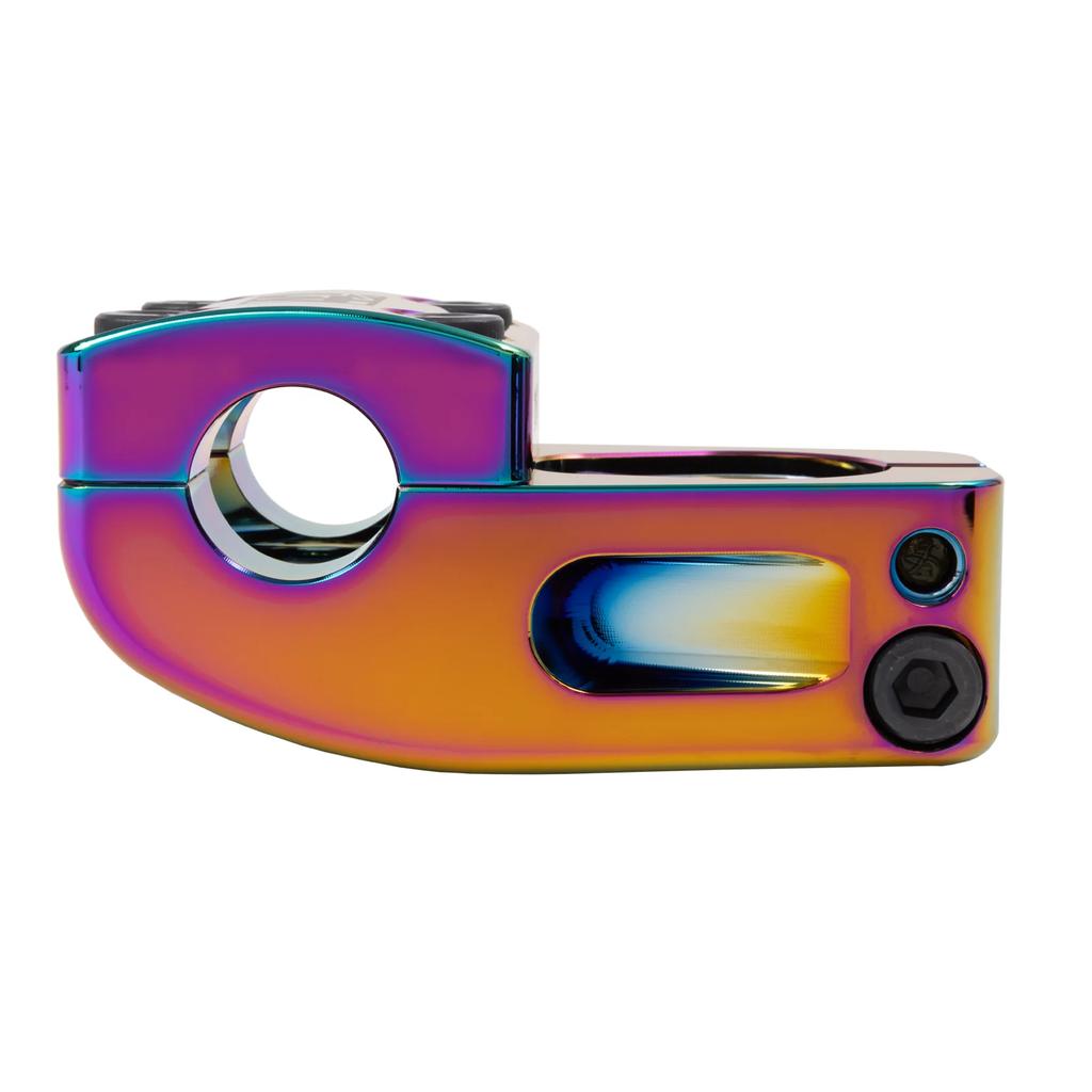 The Odyssey Broc V2 40th Anniversary Top Load Stem, a Broc Raiford signature piece, features a multicolored metallic finish and compact design with a round opening and well-positioned bolt holes for optimal performance.