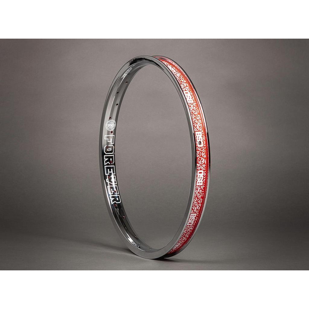 The BSD Forever Rim stands upright on a grey background, featuring bold "FOREVER" lettering, a red patterned inner strip, and a strong I-beam design—making it a top choice for BMX riders.