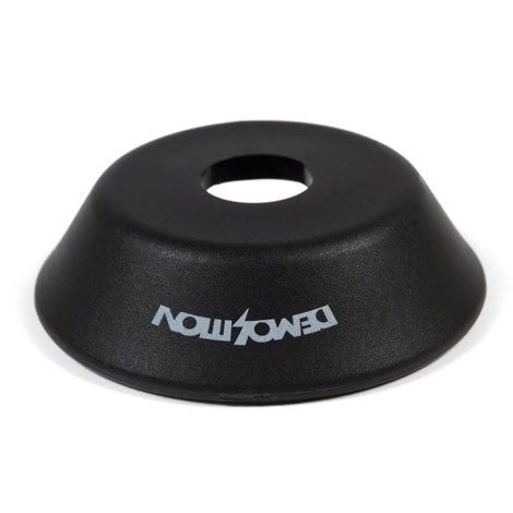 A black, cone-shaped Demolition Whistler Pro Rotar Drive Side Hub Guard with a central hole and the white DEMOLITION logo printed on the surface.