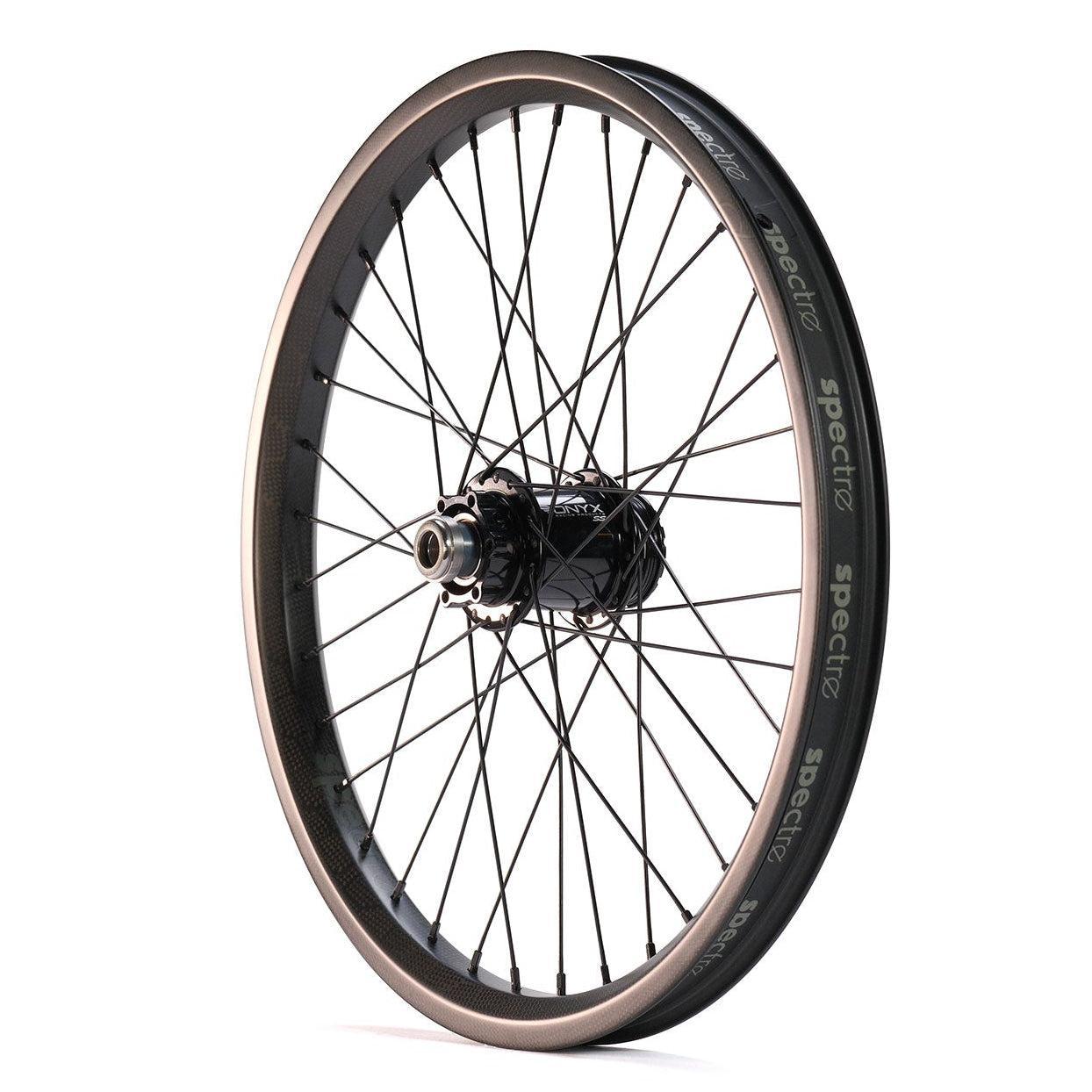 A single black bicycle wheel with a carbon fiber rim, black spokes, central hub, and "spectre" branding from the Spectre NME X Onyx Elite 20 Inch Disc Wheel Set (20mm/15mm), known for lightweight and strong BMX rims.