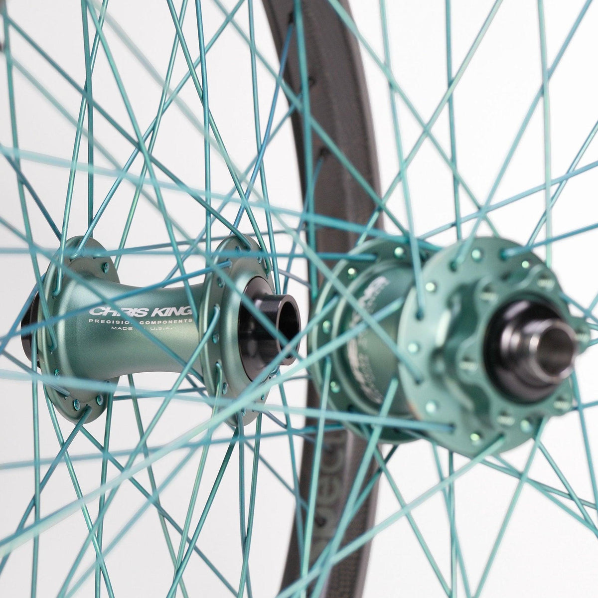 Chris King X Spectre NME Custom 20inch Wheel Set featuring two carbon rim BMX race wheels with teal hubs, branded lettering, and matching teal spokes.