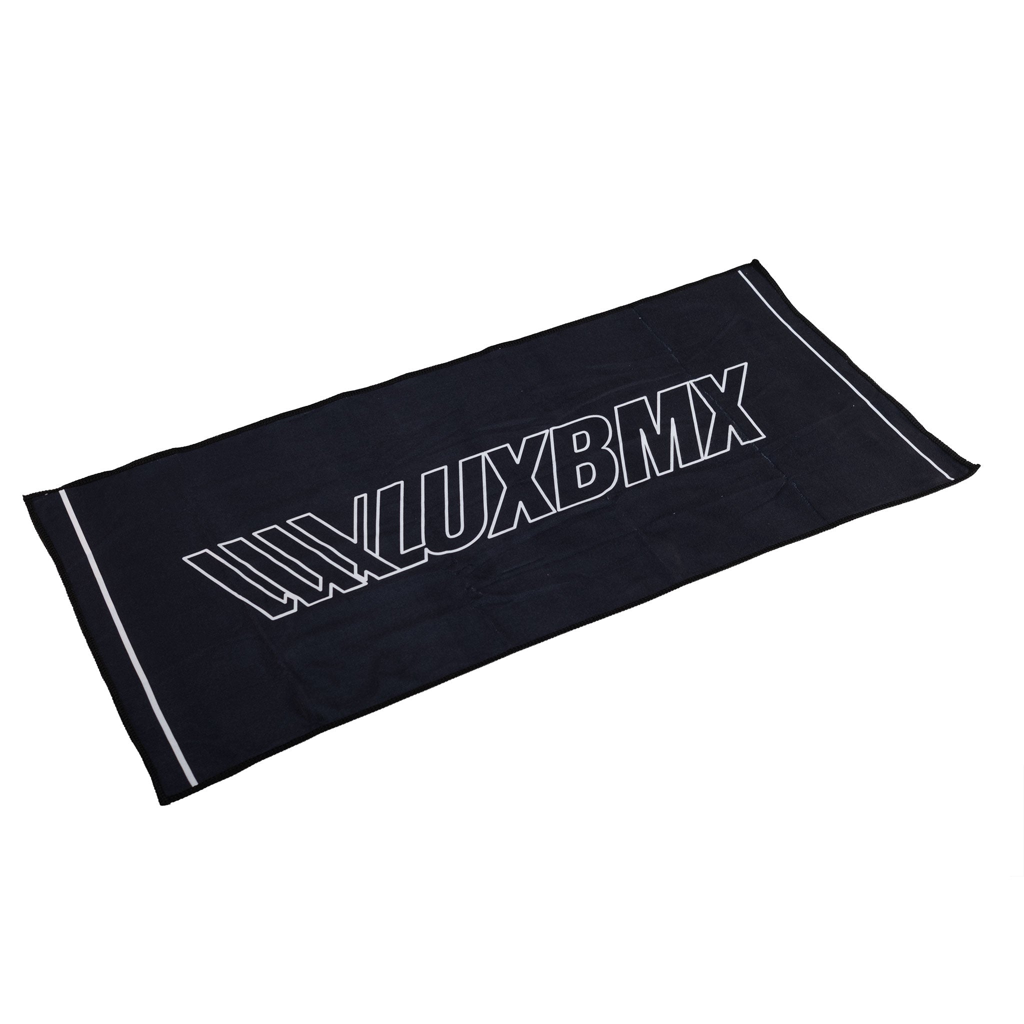 The LUXBMX Sweat Towel is black with white edge stripes and bold "LUXBMX" across the center. This quick-dry microfibre towel is ideal for workouts or BMX sessions.