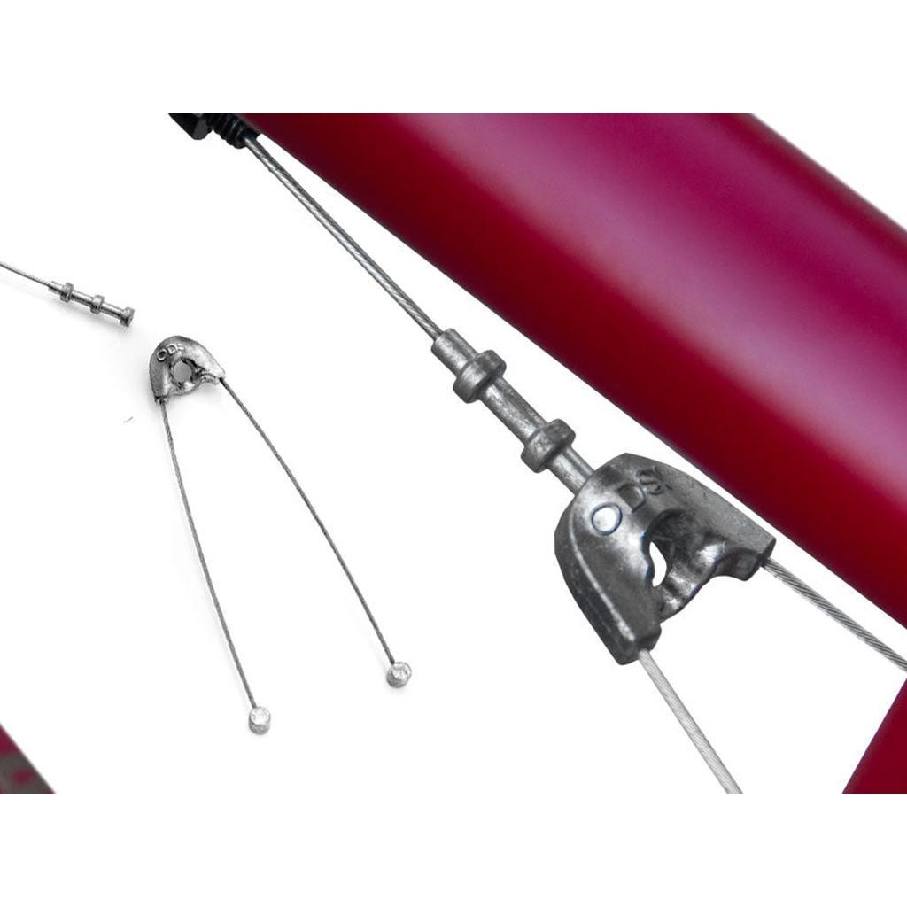 Close-up of a bicycle braking cable and housing with an anchor bolt attached, and a detached Odyssey Linear Quik Slic Brake Cable straddle cable nearby.