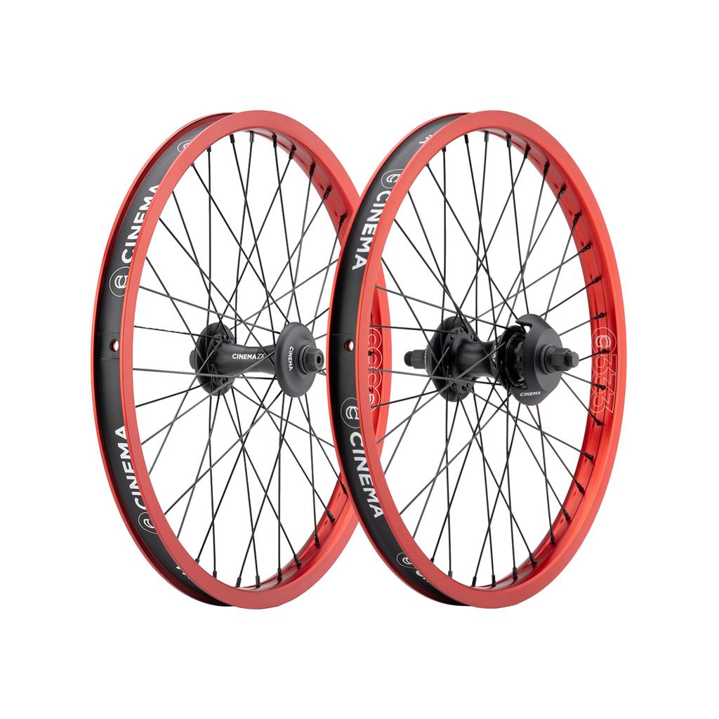 Cinema 333/ZX 20 Inch Wheel Set with black spokes and red rims featuring white branding.