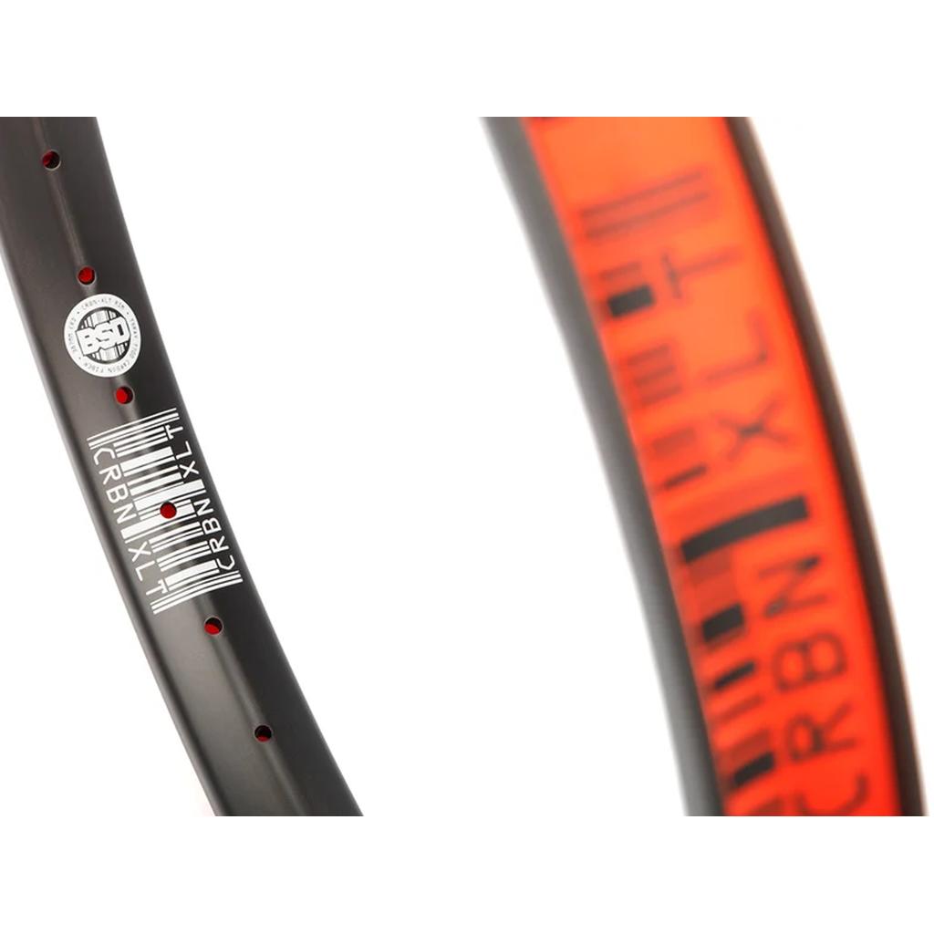 Black BSD Crbn-xlt 20 Inch Rim featuring red accent decals and spoke holes.