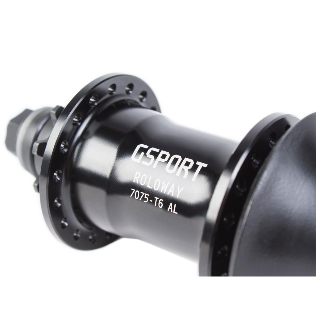 Close-up of the G-Sport Roloway Rear Hub, a black metal BMX hub labeled "GSPORT ROLOWAY 7075-T6 AL" with multiple spoke holes visible. Compatible with both RHD and LHD setups, this rear hub provides versatile options for riders.
