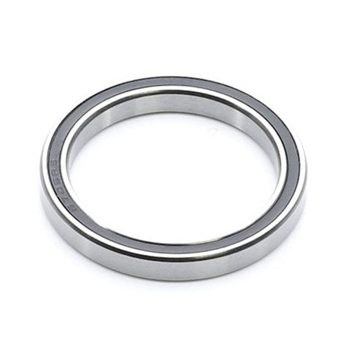 A close-up of an Enduro A3 LLB Sealed Bearing, featuring a thin metal ring with a visible black seal, crafted from 52100 High Carbon Chromium Steel and displayed on a white background.