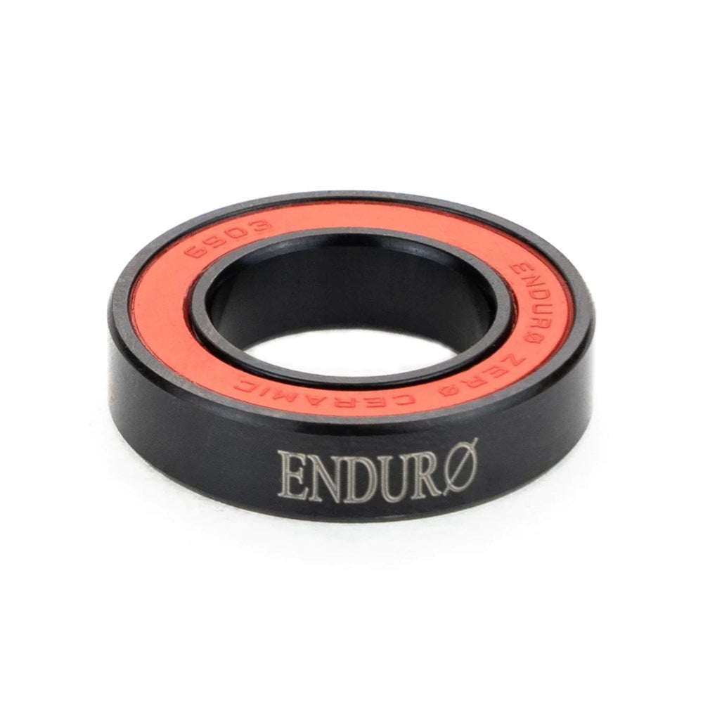 Enduro ZERO Ceramic Sealed Bearing (each) branded ZERØ Ceramic bearing with black exterior and red interior showcases low rolling resistance, the perfect race day weapon on a white background.