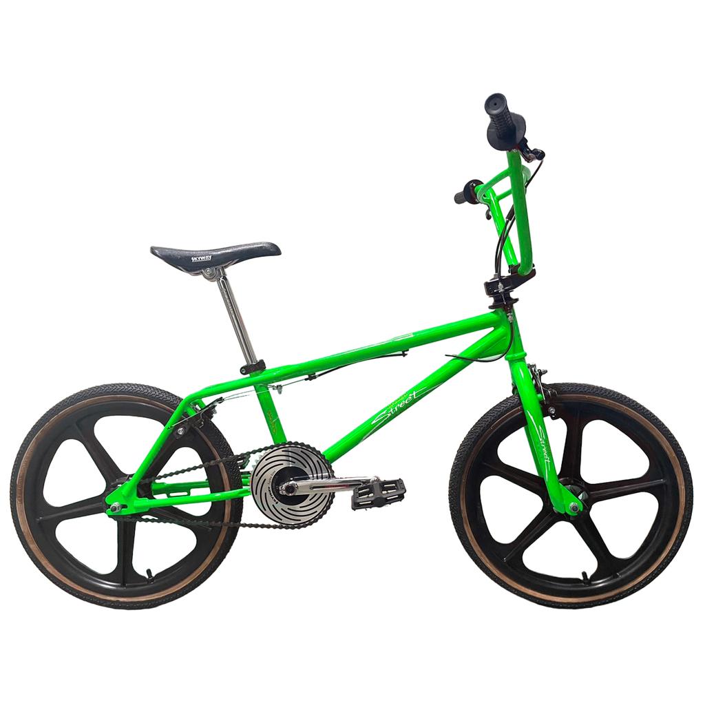 A Skyway Street Beat 20 Inch Bike in green with black mag wheels, a black seat, and a silver chainring is shown from the side against a white background.