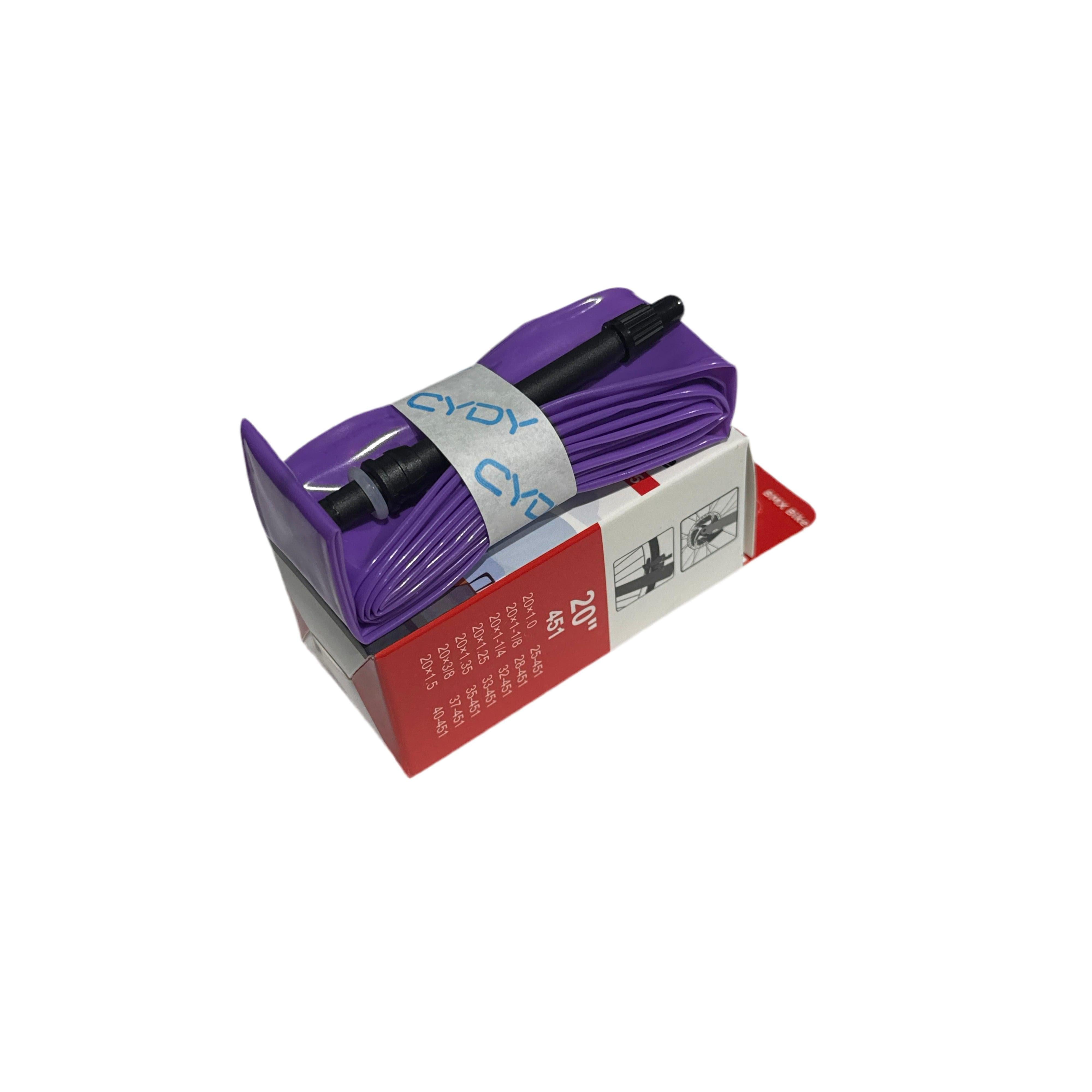 The CYDY TPU 20 Inch Presta Inner Tube, in purple with a black valve, is folded atop its red and white box. This ultra-light TPU tube ensures effortless rides.