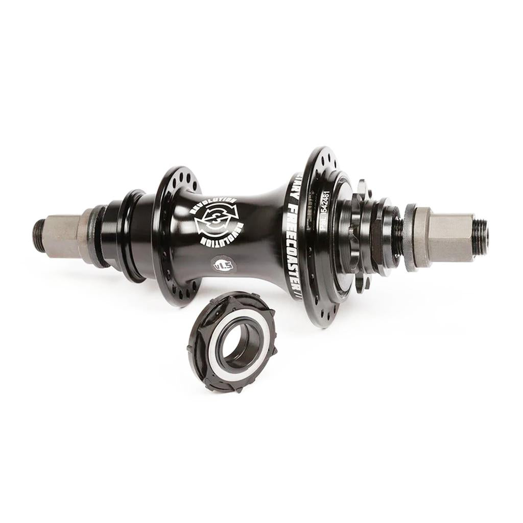 The BSD Revolution V1.5 Freecoaster Hub (Male Axle) in black, with cog and planetary clutch, is shown on a white background alongside a separate bearing placed in front.