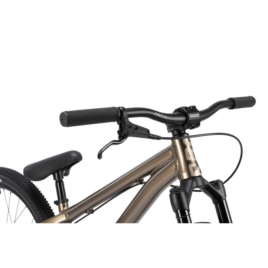 Close-up of the Radio Griffin 24 Inch Dirt Jumper Bike’s handlebars, brake lever, front fork, and part of the saddle, highlighting its 24” aluminium frame and sleek black components.