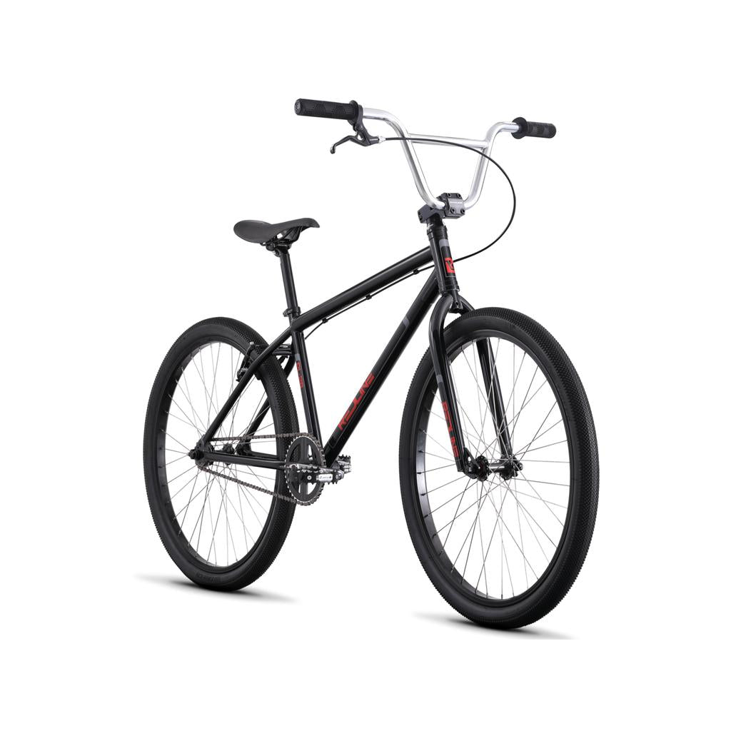 The Redline PL 26 Inch Bike is a black BMX cruiser with large tires, straight handlebars, and a minimalist chromoly steel frame, displayed against a white background.