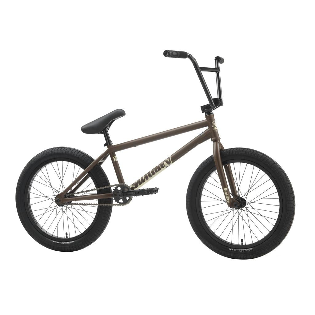 The Sunday EX Julian Arteaga 20 Inch Bike, with a brown 20.75" chromoly frame and black handlebars, seat, and tires, is shown from the side against a white background.