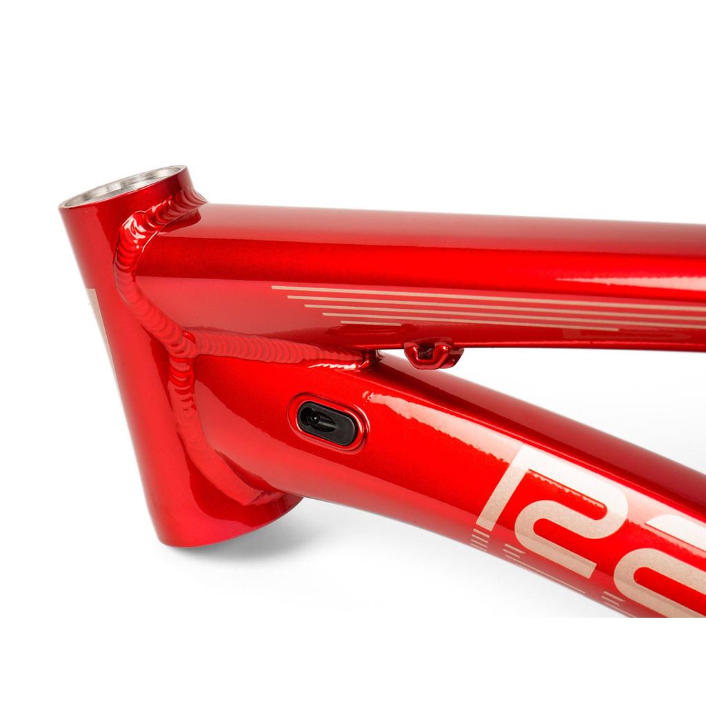Close-up of the Radio Raceline Quartz 2025 Pro XL Cruiser Frame in shiny red aluminium, highlighting the head tube, top tube, down tube, and integrated cable port.