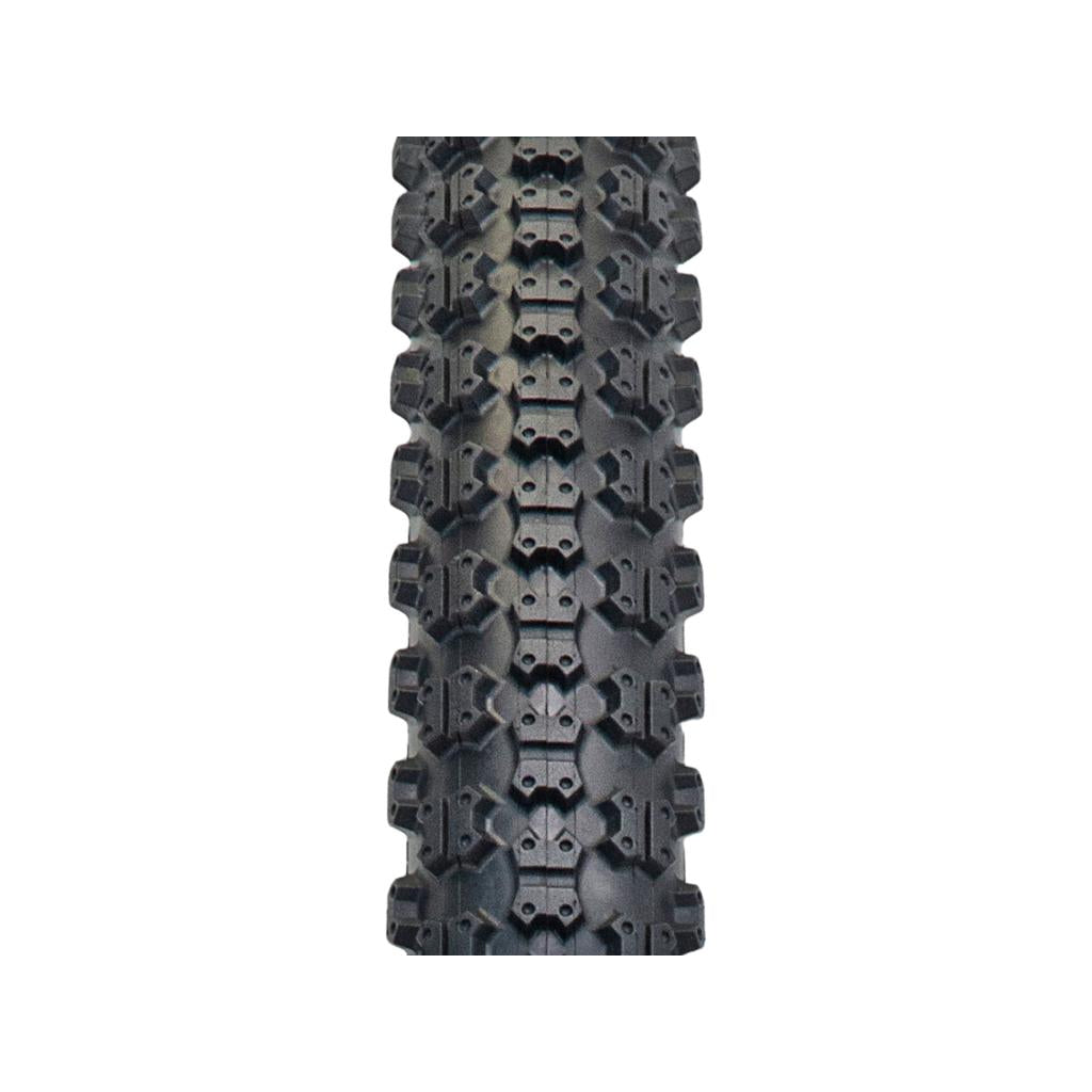 A close-up of the Tioga Comp 3 Skin Wall Tyre (20 Inch) in black shows its knobby tread and classic skinwall, photographed from above on a white background.