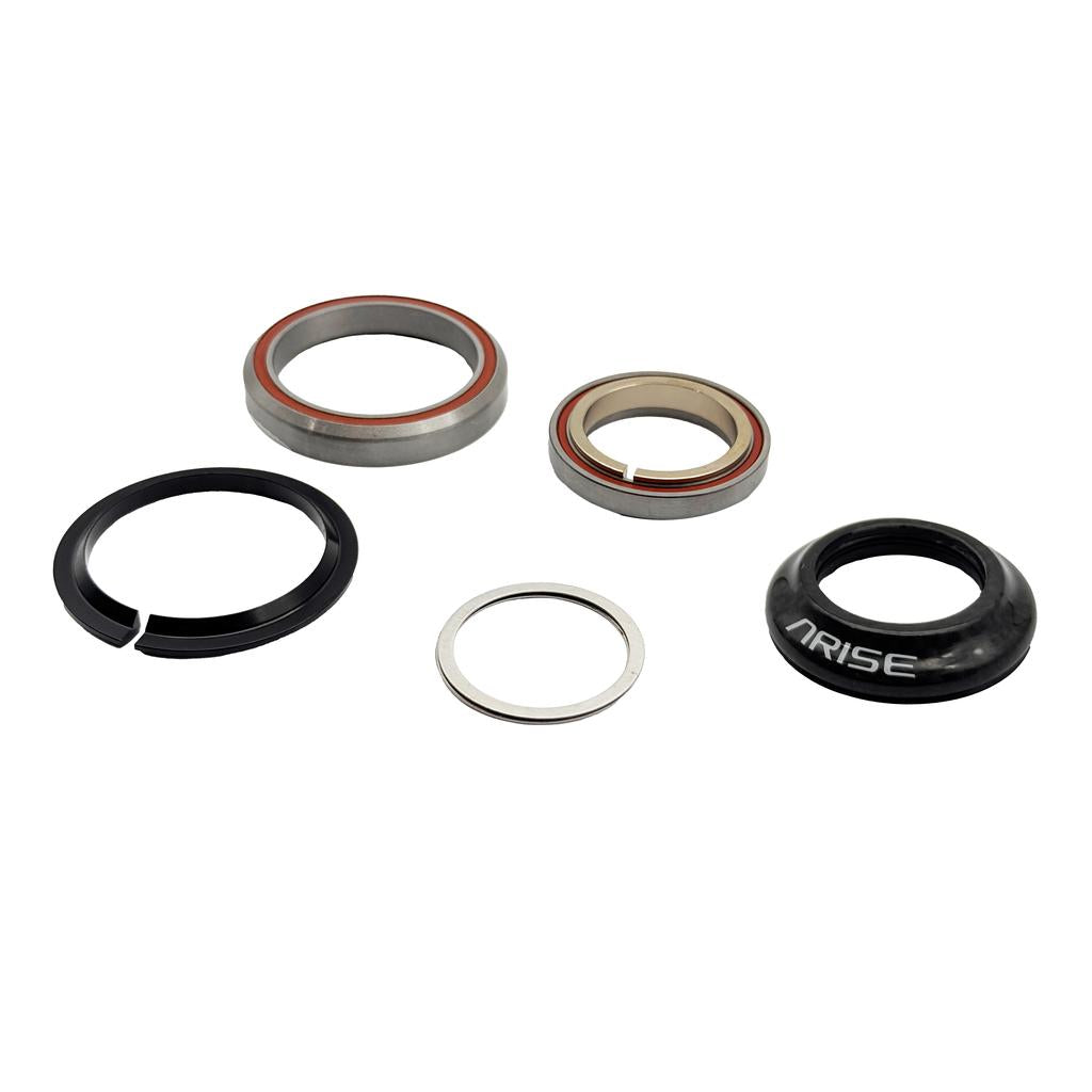 Five components for the Arise Crystal 8 Tapered Headset—two bearings, a split compression ring, a washer, and a black carbon fibre top cap labeled "ARISE"—are arranged on a white background, ideal for your integrated headset setup.