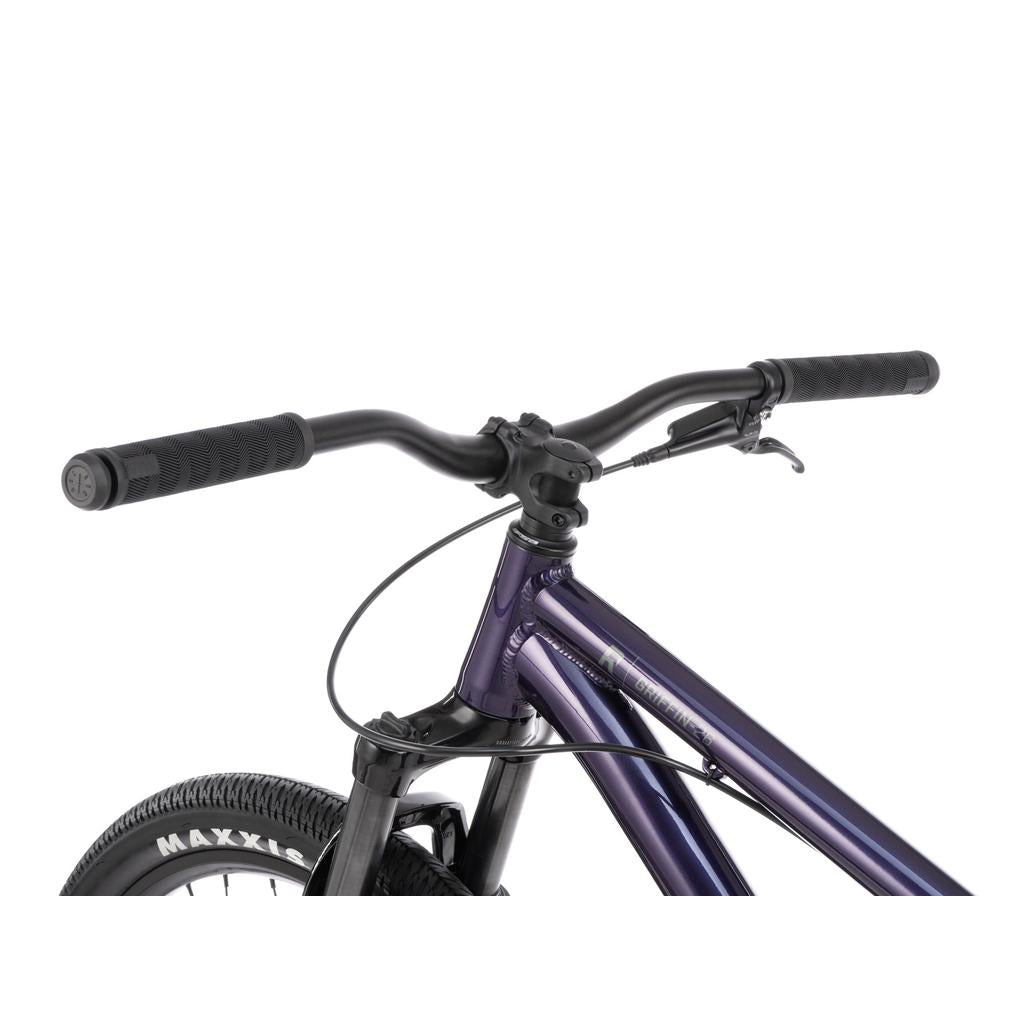 Close-up of the Radio Griffin 26 Inch Bike’s handlebars, brake lever, and front wheel featuring a metallic purple frame, black components, and Maxxis DTH tyres.