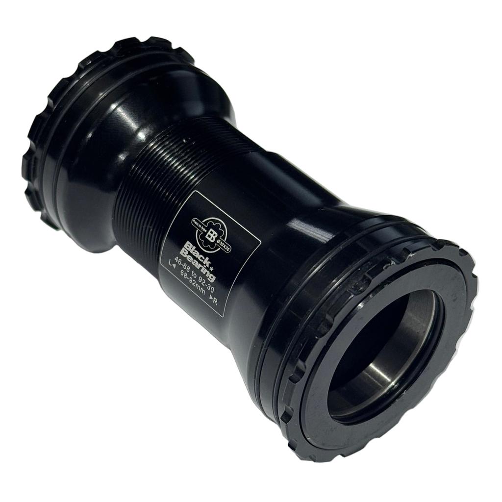 The Black Bearing B5 BB386 EVO M30 Praxis Bottom Bracket features threaded cups, CNC machined aluminum construction, BBlock technology, labeled branding, and is shown isolated on a white background.