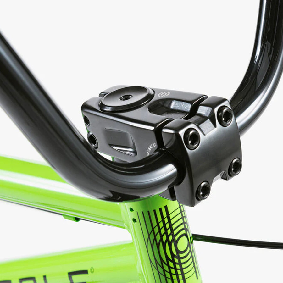 A close up of the new star handlebar on a green Wethepeople Nova 20 Inch BMX bike.