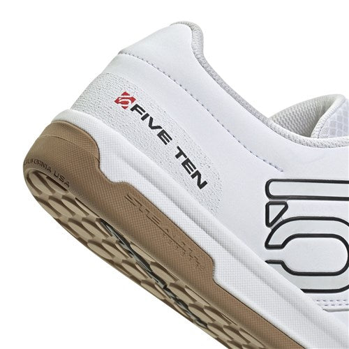 Close-up of the heel of a white Five Ten Freerider Pro Flat Core Shoe (WHT/CORE BLK/RED) with tan sole, featuring the "FIVE TEN" logo and tread pattern for pedal-gripping control.