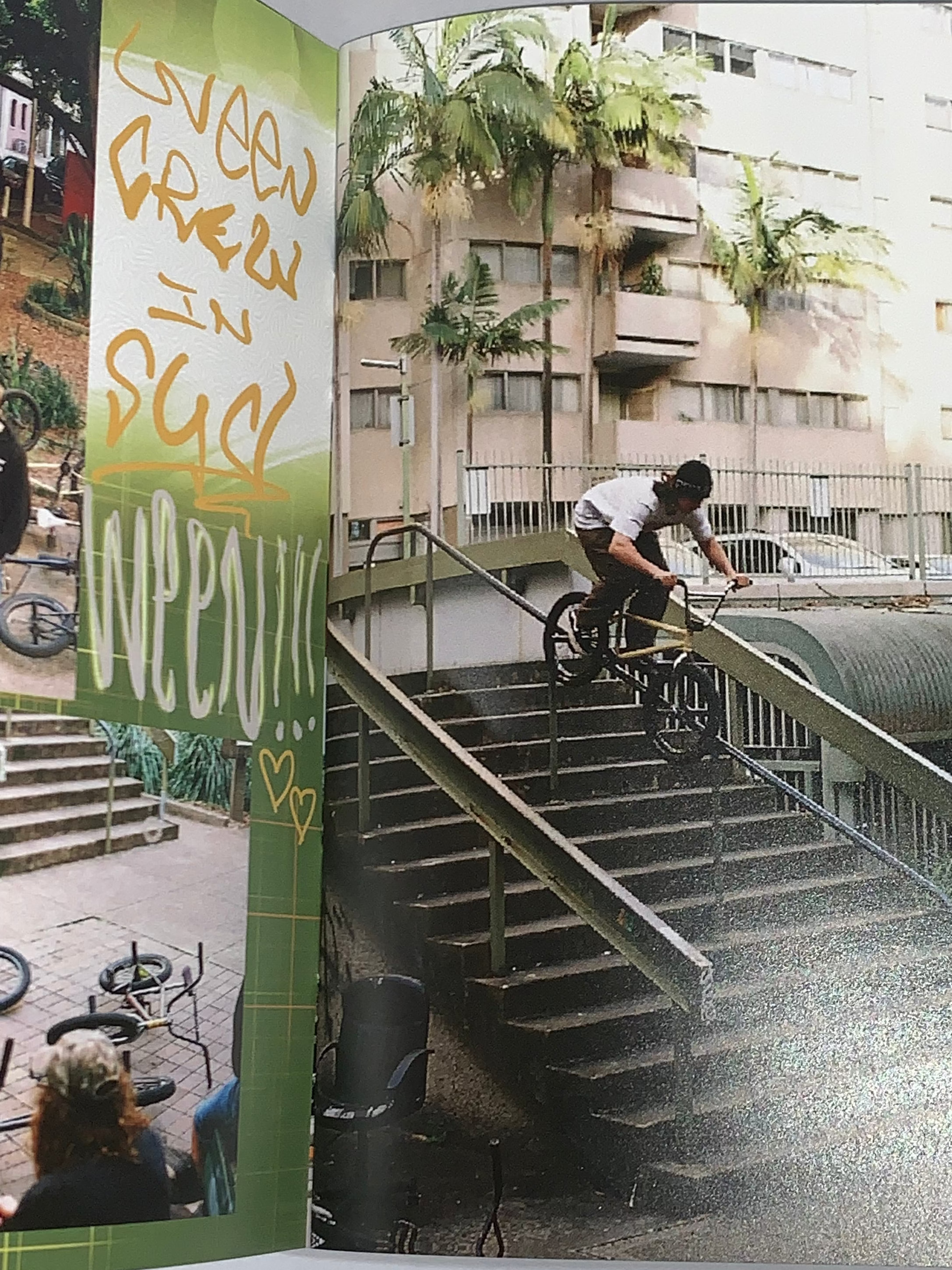 A BMX rider from a local crew grinds a stair rail outside, with apartments and palm trees behind him, as featured in Jerk Zine Volume 1.