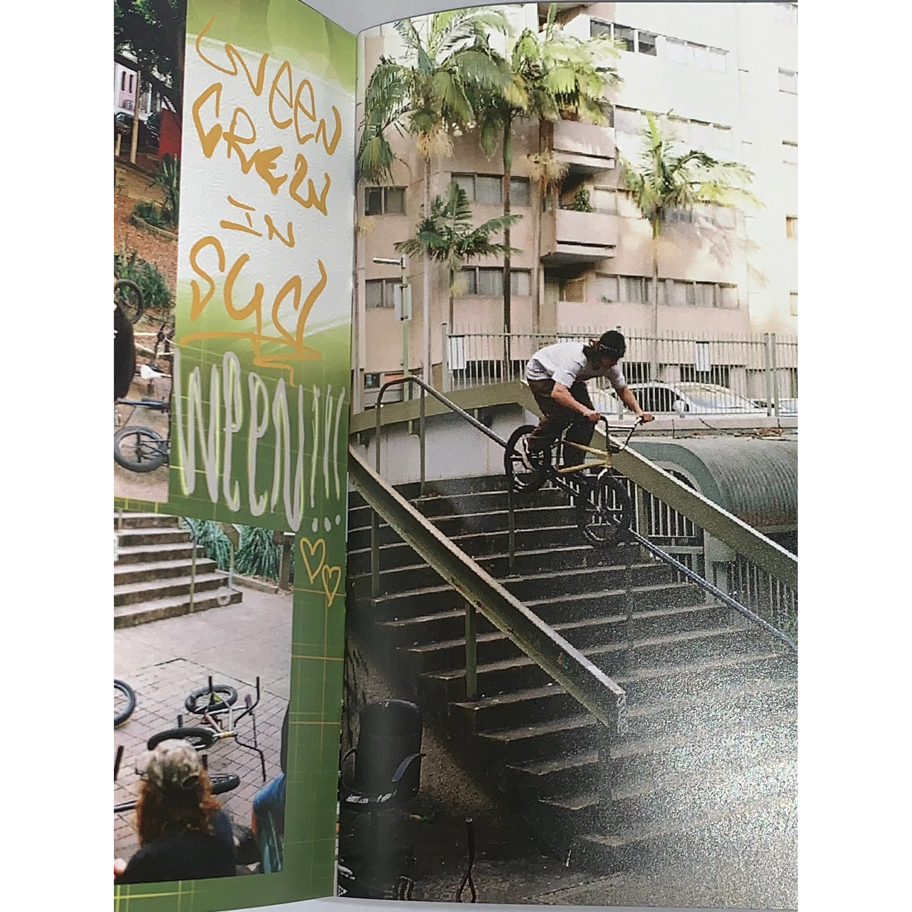 A BMX rider from a local crew grinds a stair rail outside, with apartments and palm trees behind him, as featured in Jerk Zine Volume 1.