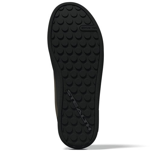 The Five Ten Freerider Pro Flat Core Shoes feature a black sole with circular grip pattern and "STEALTH" embossed across the middle for pedal-gripping control, plus a small "NON-MARKING" label near the top edge.