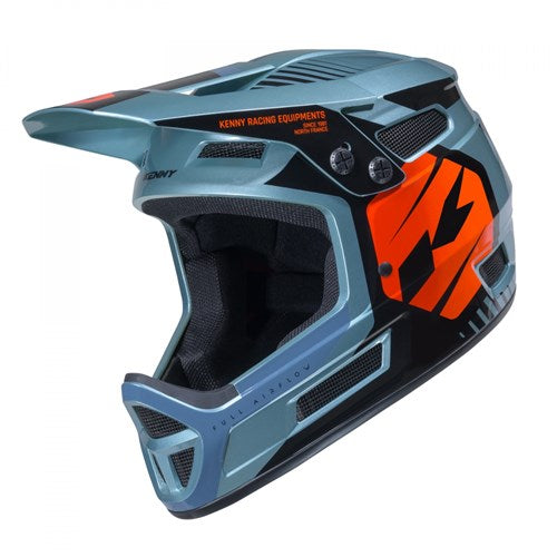 Introducing the Kenny Racing Elite Helmet Graphic Sunset: a metallic blue full-face BMX helmet with striking black and orange accents, featuring a visor and multiple ventilation openings. Engineered for racing or off-road adventures, this lightweight helmet delivers high performance in even the smallest sizes—including XXXS—making it ideal for riders seeking top-tier BMX race helmets.
