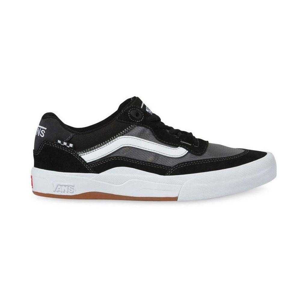 Sentence with replacement: A single black and white Vans Wayvee Pro Shoes sneaker with a WAFFLECUP outsole and a brown bottom.