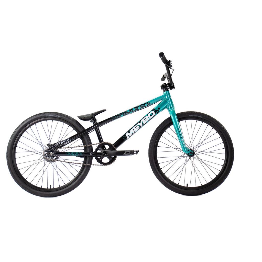 The Meybo 2026 Clipper Pro Cruiser Bike, featuring a compact frame, thick tires, and raised handlebars in blue and black, is displayed against a white background.