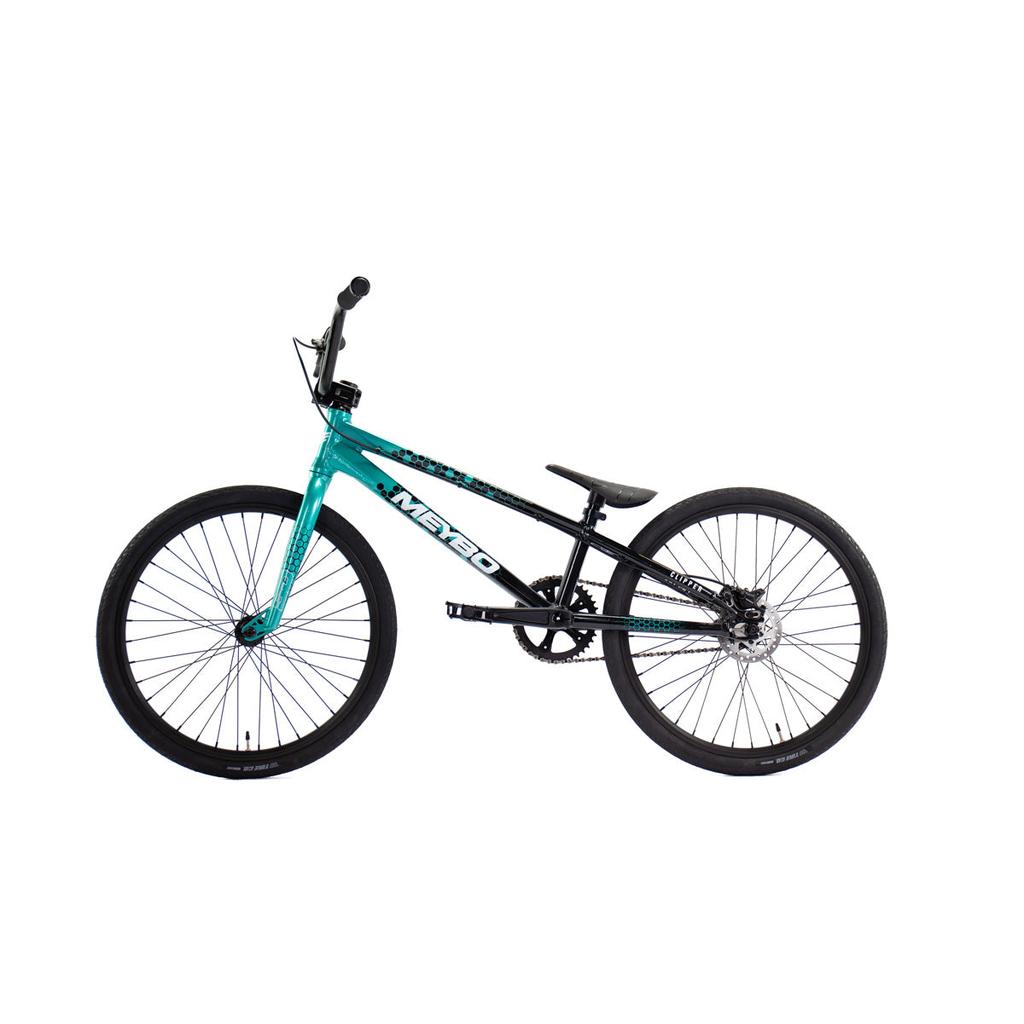 A Meybo 2026 Clipper Expert Bike in teal and black, featuring a lightweight frame, large tires, and a single gear, photographed against a plain white background.