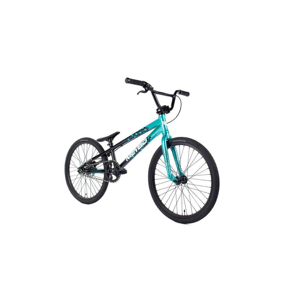 A Meybo 2026 Clipper Expert Bike, featuring a teal and black frame with wide handlebars and thick tires, is displayed on a white background.