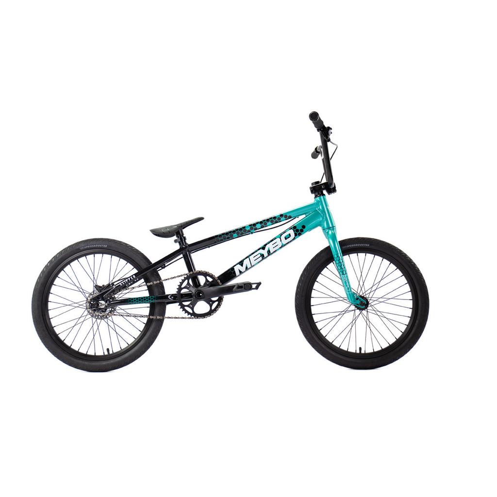 The Meybo 2026 Clipper Pro XXL Bike, featuring a black and teal frame with black wheels and "Mero" branding, is shown in profile on a white background—ideal as an entry-level BMX race bike.