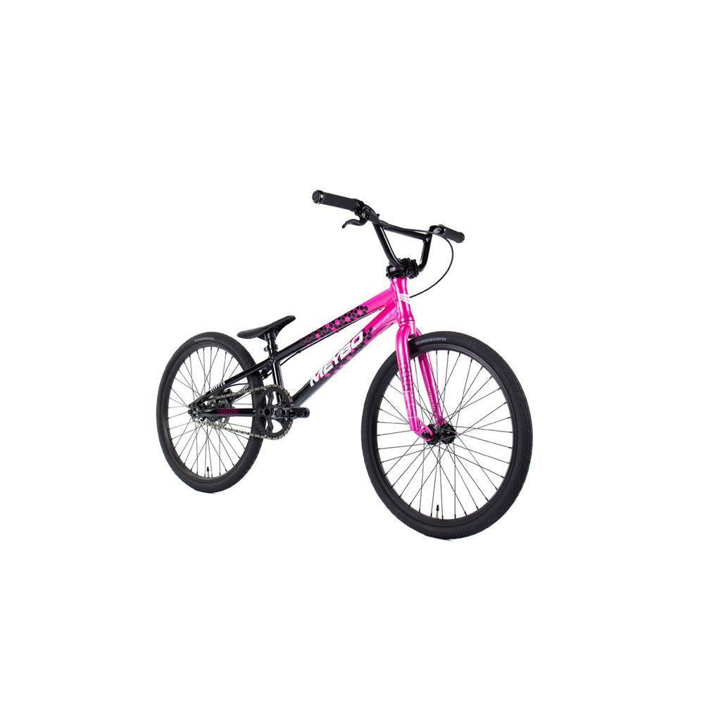 The Meybo 2026 Clipper Expert Bike features a pink and black frame, straight handlebar, and black tires, displayed at an angle on a white background—an ideal entry-level BMX race bike.