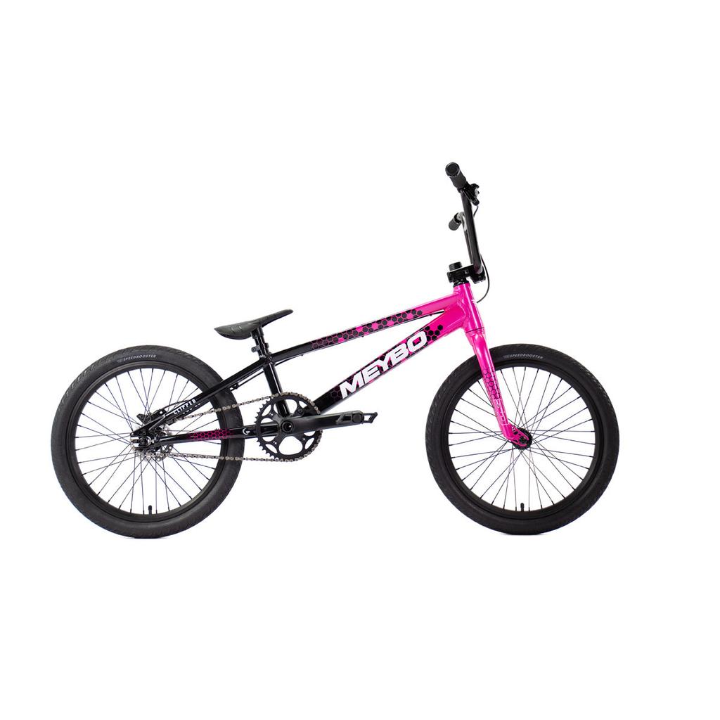 The Meybo 2026 Clipper Pro XXL Bike, shown in pink and black with a sturdy frame, thick tires, and high handlebars against a white background, is an ideal entry-level race bike for BMX enthusiasts.