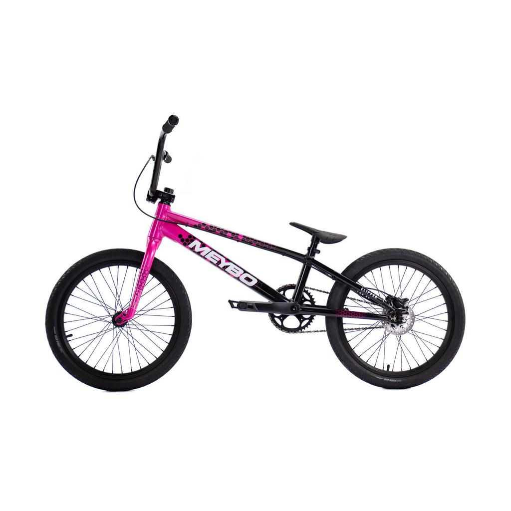 The Meybo 2026 Clipper Pro XXL Bike, shown in side profile with a pink and black frame, black tires, and handlebars, is an ideal entry-level BMX race bike for newcomers to the sport.
