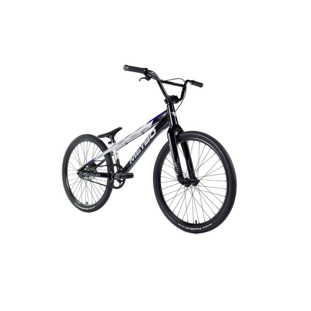 The Meybo 2026 Superclass Pro Cruiser Bike is a black and silver BMX racing bike with a 22-inch top tube, large tires, flat handlebars, and a lightweight frame—ideal for tall riders—shown on a white background.