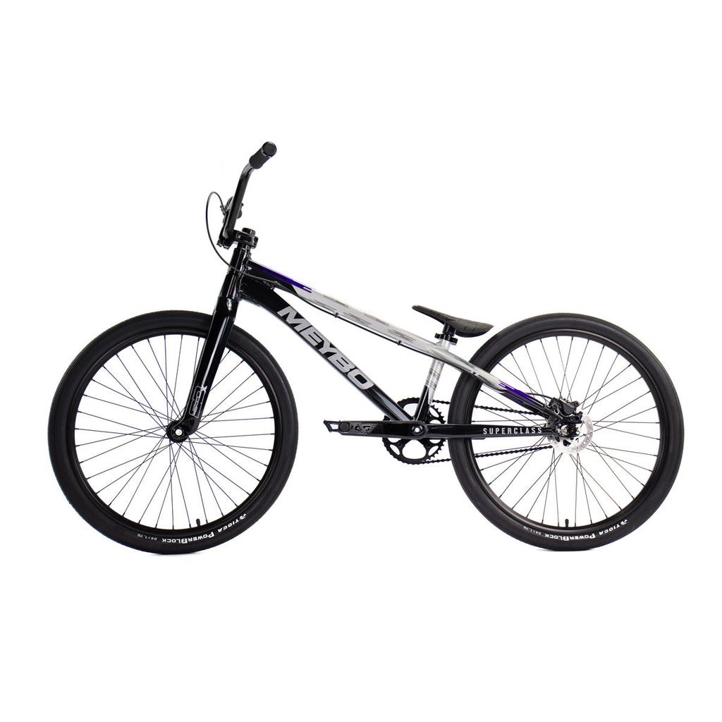 Side view of the Meybo 2026 Superclass Pro XL Cruiser Bike, a black and white BMX with a lightweight frame, thick tires, and flat pedals—perfect for tall riders seeking top racing performance.