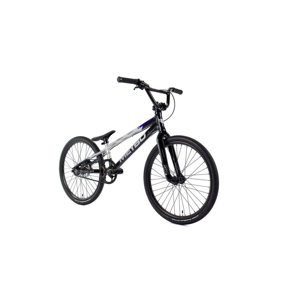 The Meybo 2026 Superclass Expert Bike is a black and white BMX racing bike with a lightweight frame, flat handlebars, front and rear wheels, and no visible accessories, designed for tall riders and set against a plain white background.