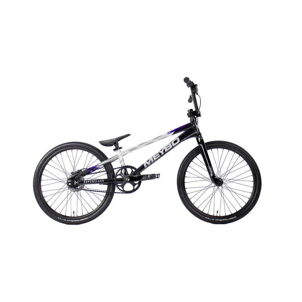 The Meybo 2026 Superclass Expert XL Bike is a black and white BMX racing bike with a lightweight frame, flat seat, and large wheels—ideal for tall BMX enthusiasts. Displayed on a white background.