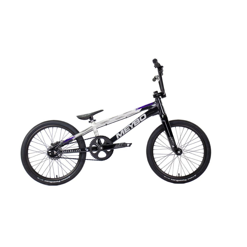 Side view of a black, white, and purple Meybo 2026 Superclass Pro XL BMX racing bike with “MEYBO” branding, black wheels, and a single gear for tall BMX riders, shown against a white background.