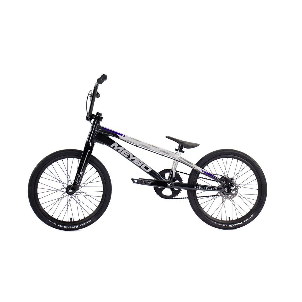 Side view of the Meybo 2026 Superclass Pro XL, a black and white BMX racing bike with a lightweight frame, flat handlebars, and single gear, designed for tall riders and built for race track speed.